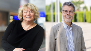 Eine Frau und ein Mann mit Brille im Anzug